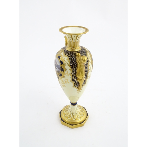 109 - A Wedgwood pedestal vase with twin handles, gilt decoration and hand painted mountain landscape. Mar... 