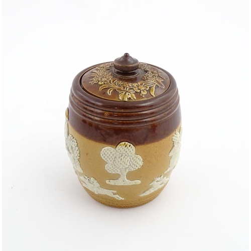 110 - A Royal Doulton two tone stoneware tobacco pot / jar with applied hunting decoration. Marked under a... 