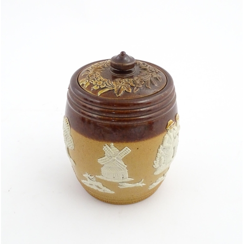 110 - A Royal Doulton two tone stoneware tobacco pot / jar with applied hunting decoration. Marked under a... 