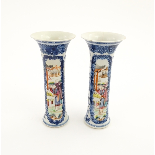 13 - A pair of Chinese vases of cylindrical form with flared rims, with panelled decoration depicting fig... 