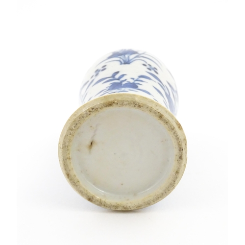 15 - A Chinese blue and white vase decorated with flowers, foliage, birds and insects. Approx. 5 1/4