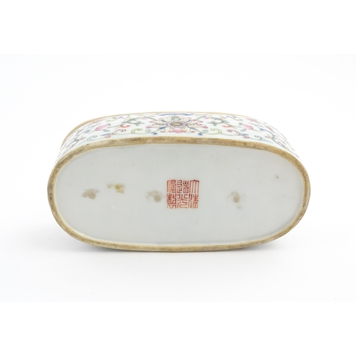 29 - A Chinese famille rose porcelain cricket box decorated with scrolling flowers and foliage. Character... 