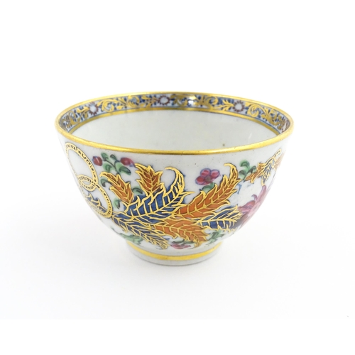 157A - A New Hall tea bowl decorated in the Tobacco Leaf pattern. Approx. 2