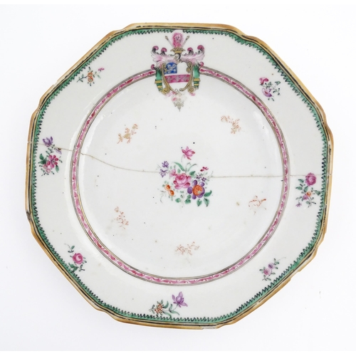 33 - A Chinese export dish of octagonal form decorated with an armorial, flowers and foliage. Approx. 6 1... 