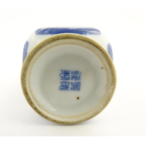 34 - Three Chinese items comprising a small blue and white vase with floral and foliate decoration, a stu... 