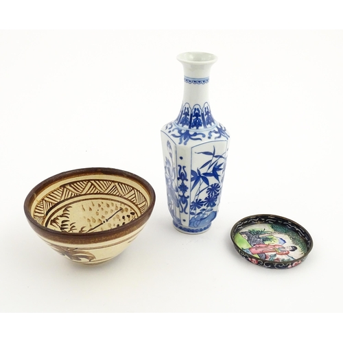 34 - Three Chinese items comprising a small blue and white vase with floral and foliate decoration, a stu... 