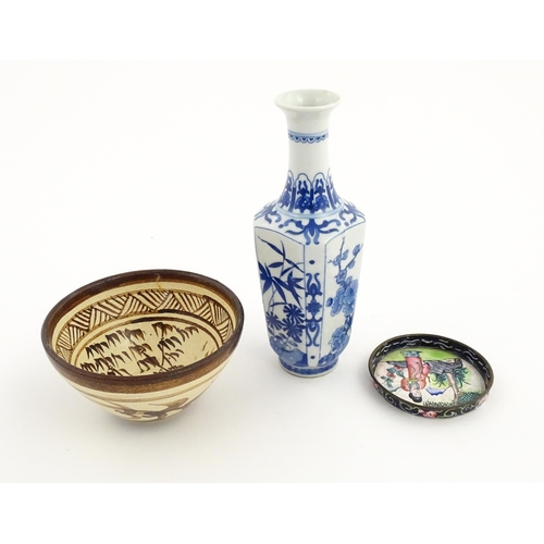 34 - Three Chinese items comprising a small blue and white vase with floral and foliate decoration, a stu... 