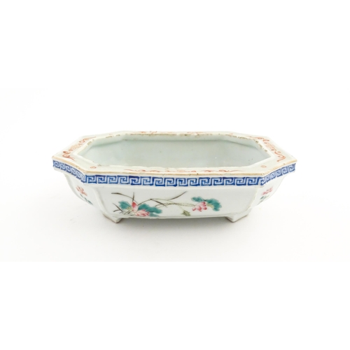 44 - A Chinese famille rose dish decorated with flowers and a Greek Key border. Approx. 7