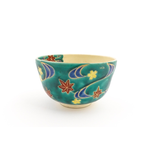 5 - A Japanese Kiyomizu studio pottery bowl, decorated with flowers. Character marks to base. Approx. 2 ... 