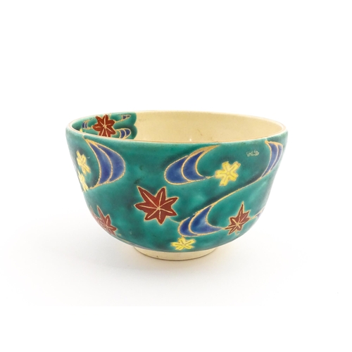 5 - A Japanese Kiyomizu studio pottery bowl, decorated with flowers. Character marks to base. Approx. 2 ... 