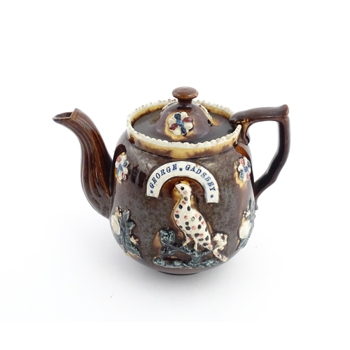 75 - Three items of Victorian Measham bargeware comprising a teapot decorated with birds and flowers with... 