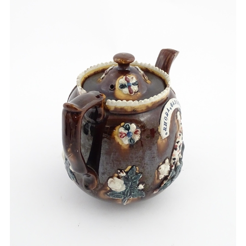 75 - Three items of Victorian Measham bargeware comprising a teapot decorated with birds and flowers with... 