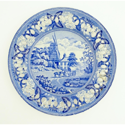 94 - A blue and white plate with a reticulated border decorated in the British Scenery pattern depicting ... 