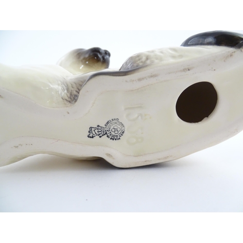 111 - A Royal Doulton model of a Siamese cat, no. 1558. Marked under. Approx. 4 3/4