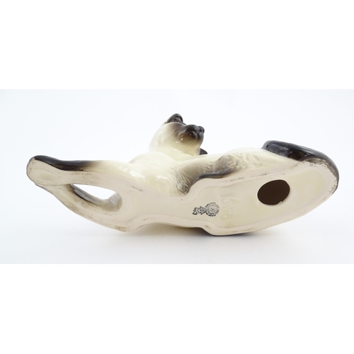 111 - A Royal Doulton model of a Siamese cat, no. 1558. Marked under. Approx. 4 3/4