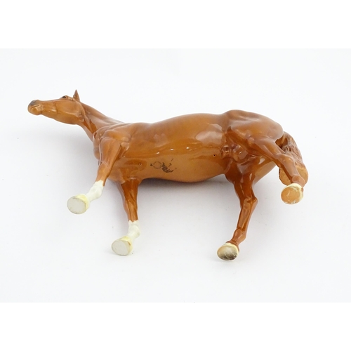 114 - A large Beswick model of a chestnut racehorse, model no. 1564. Marked under and numbered 95. Horse a... 