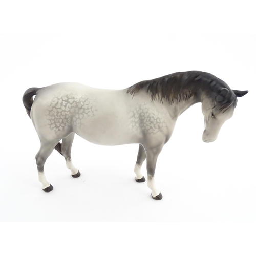 115 - Two Beswick models of horses comprising a foal no. 915 and a grey horse. Largest approx. 5 1/4