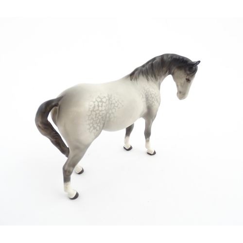 115 - Two Beswick models of horses comprising a foal no. 915 and a grey horse. Largest approx. 5 1/4