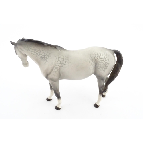 115 - Two Beswick models of horses comprising a foal no. 915 and a grey horse. Largest approx. 5 1/4