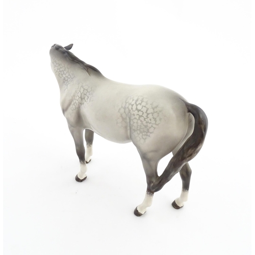 115 - Two Beswick models of horses comprising a foal no. 915 and a grey horse. Largest approx. 5 1/4