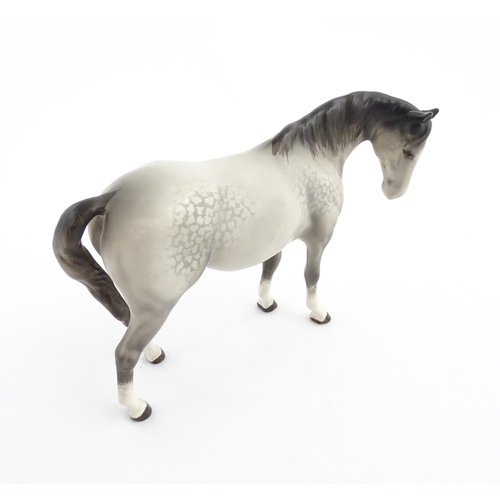 115 - Two Beswick models of horses comprising a foal no. 915 and a grey horse. Largest approx. 5 1/4