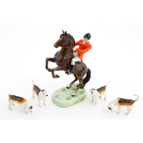 116 - A Beswick model Rearing Huntsman no. 868 modelled as a huntsman on a brown horse. Marked under. Toge... 