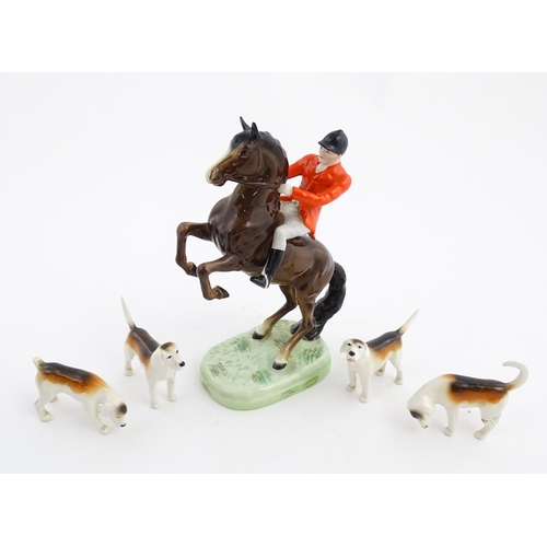 116 - A Beswick model Rearing Huntsman no. 868 modelled as a huntsman on a brown horse. Marked under. Toge... 