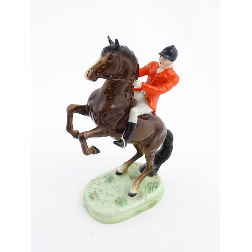 116 - A Beswick model Rearing Huntsman no. 868 modelled as a huntsman on a brown horse. Marked under. Toge... 