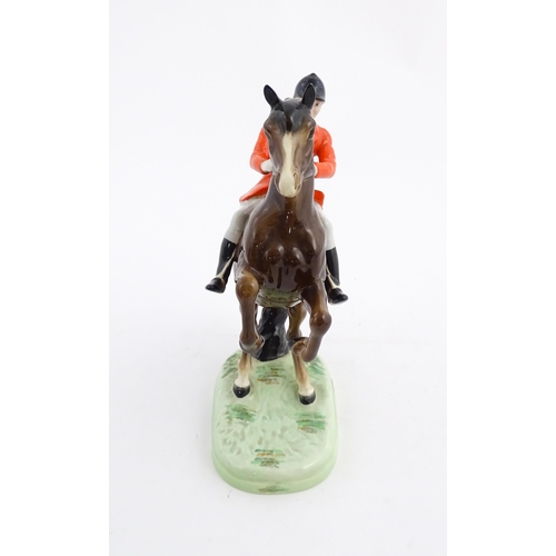 116 - A Beswick model Rearing Huntsman no. 868 modelled as a huntsman on a brown horse. Marked under. Toge... 