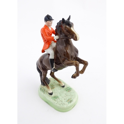 116 - A Beswick model Rearing Huntsman no. 868 modelled as a huntsman on a brown horse. Marked under. Toge... 