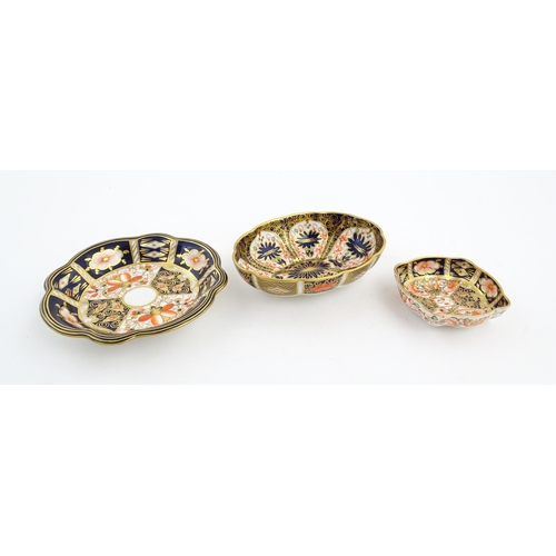 117 - Four assorted Royal Crown Derby dishes decorated in the Imari palette. Marked under. Largest approx.... 