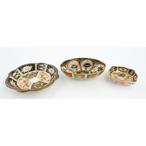 117 - Four assorted Royal Crown Derby dishes decorated in the Imari palette. Marked under. Largest approx.... 