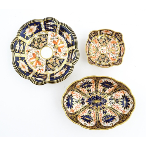 117 - Four assorted Royal Crown Derby dishes decorated in the Imari palette. Marked under. Largest approx.... 