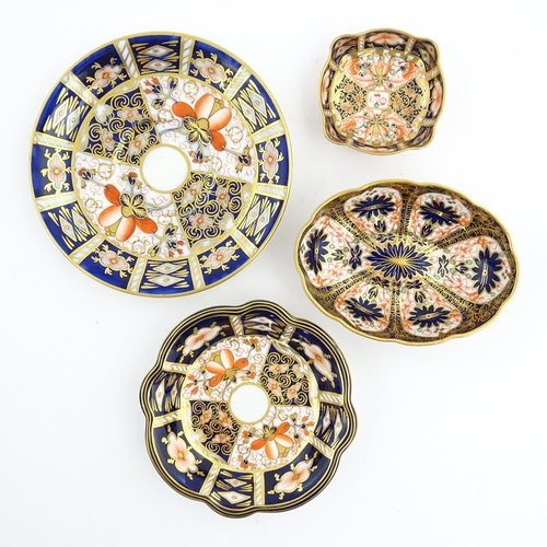 117 - Four assorted Royal Crown Derby dishes decorated in the Imari palette. Marked under. Largest approx.... 