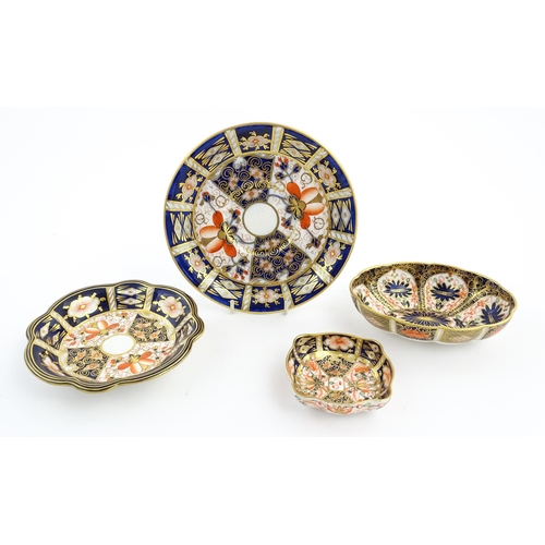 117 - Four assorted Royal Crown Derby dishes decorated in the Imari palette. Marked under. Largest approx.... 