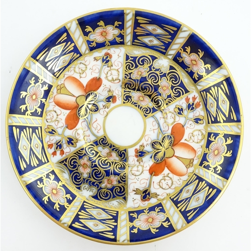 117 - Four assorted Royal Crown Derby dishes decorated in the Imari palette. Marked under. Largest approx.... 