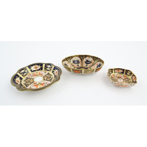 117 - Four assorted Royal Crown Derby dishes decorated in the Imari palette. Marked under. Largest approx.... 