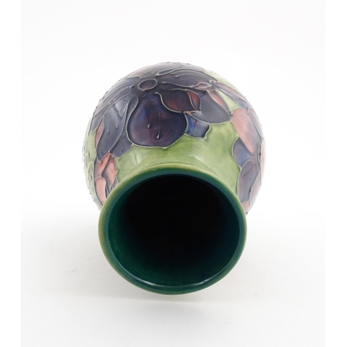 119 - A Moorcroft vase decorated in the Anemone pattern. Marked under. Approx. 7 1/2