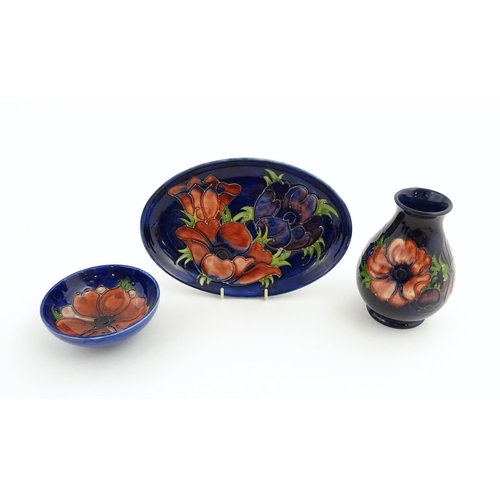 121 - Three items of Moorcroft decorated in the Anemone pattern comprising vase, small bowl and oval dish.... 