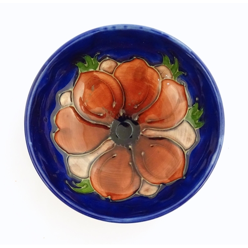 121 - Three items of Moorcroft decorated in the Anemone pattern comprising vase, small bowl and oval dish.... 