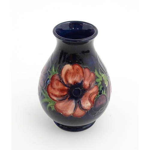 121 - Three items of Moorcroft decorated in the Anemone pattern comprising vase, small bowl and oval dish.... 