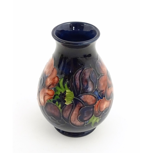 121 - Three items of Moorcroft decorated in the Anemone pattern comprising vase, small bowl and oval dish.... 