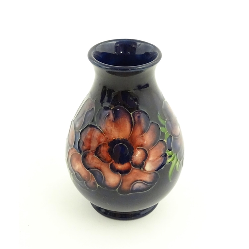 121 - Three items of Moorcroft decorated in the Anemone pattern comprising vase, small bowl and oval dish.... 