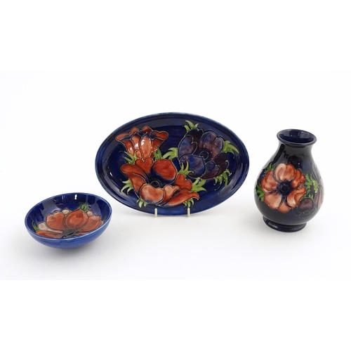 121 - Three items of Moorcroft decorated in the Anemone pattern comprising vase, small bowl and oval dish.... 