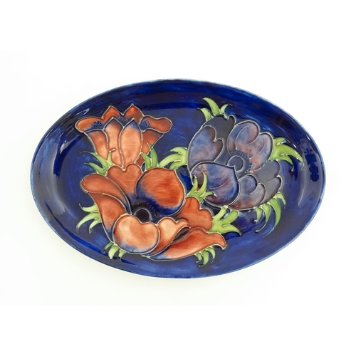 121 - Three items of Moorcroft decorated in the Anemone pattern comprising vase, small bowl and oval dish.... 