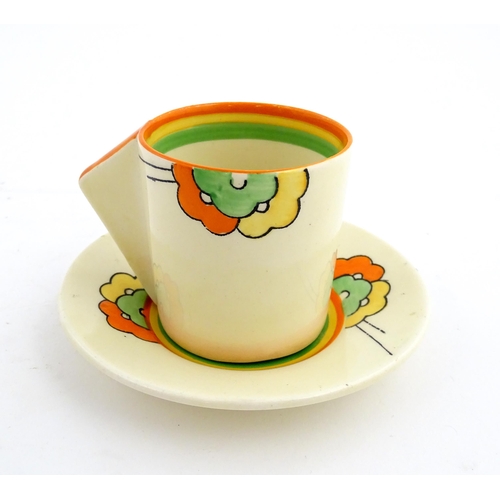 124 - An Art Deco Clarice Cliff tea cup and saucer decorated in the Nemesia pattern. Marked under. Cup app... 