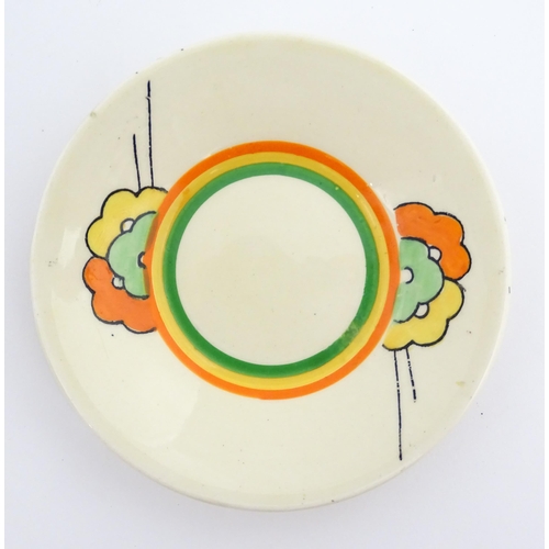 124 - An Art Deco Clarice Cliff tea cup and saucer decorated in the Nemesia pattern. Marked under. Cup app... 