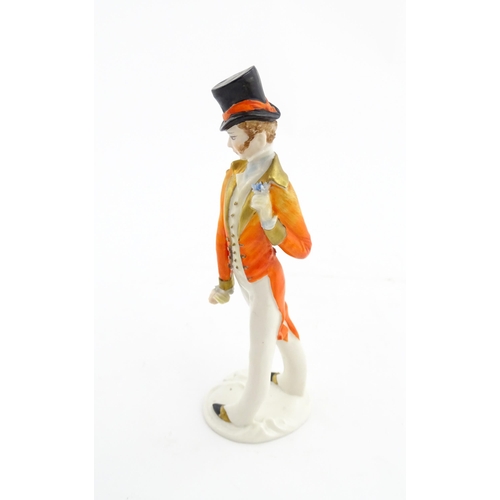 137 - A 20thC Italian Silvio Righetto figure modelled as a gentleman wearing a frock coat and a top hat. M... 