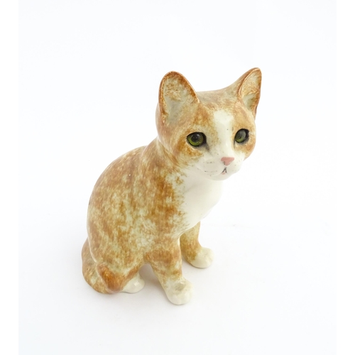 138 - A Winstanley model of a seated ginger cat. Marked under and numbered 26. Approx. 9