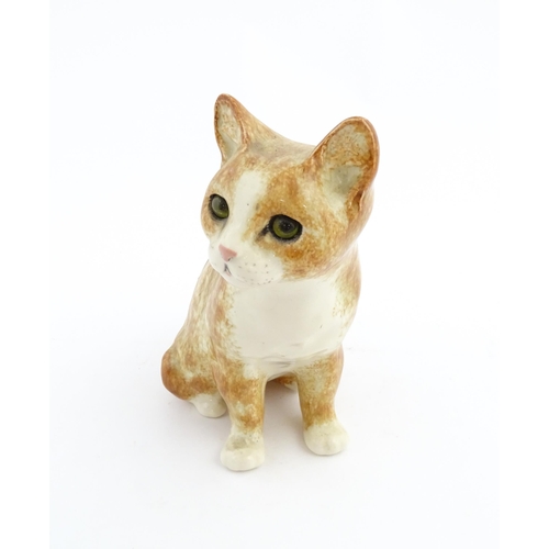 138 - A Winstanley model of a seated ginger cat. Marked under and numbered 26. Approx. 9